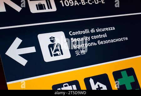Security control at the airport, signboard in several languages. Public safety, airport signage concept. Stock Photo