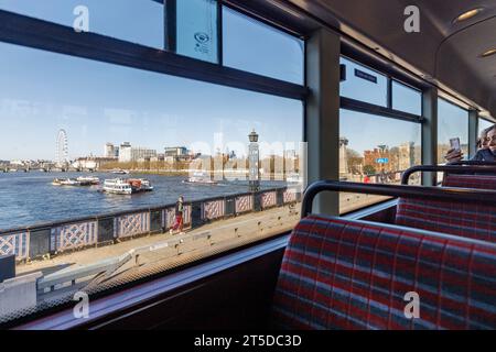 Sadiq Khan to axe landmark bus route 11 a week before Coronation.   Pictured: The view of the London Eye from the side windows of a Bus 11 passing thr Stock Photo