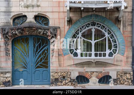 Focus on Art Nouveau style Maison Huot build in 1903 by Emile André with water lily shaped window Stock Photo