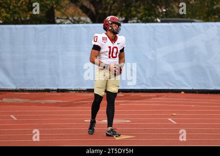 Harvard Crimson quarterback Jaden Craig #10 is congratulated after scoring a touchdown during action in the NCAA football game against the Columbia Lions at Robert K. Kraft Field at Lawrence A. Wien Stadium in New York, New York, Saturday, Nov. 4, 2023. (Photo: Gordon Donovan) Stock Photo