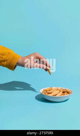 Womans hand take mini picos Stock Photo