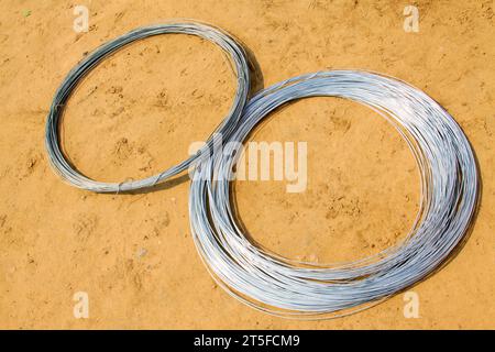 galvanized iron wire on the ground, closeup of photo Stock Photo