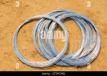 galvanized iron wire on the ground, closeup of photo Stock Photo