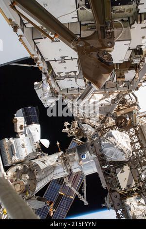 International Space Station, Earth Orbit. 01 November, 2023. NASA astronaut and Expedition 70 Flight Engineer Loral O'Hara, center, performs a spacewalk to replace one of the 12 trundle bearing assemblies on the port solar alpha rotary joint, outside the International Space Station, November 1, 2023 in Earth Orbit. The assembly allows the solar arrays to track the Sun and generate electricity to power the orbiting laboratory. Credit: NASA Astronaut/NASA/Ģ����ý Live News Stock Photo