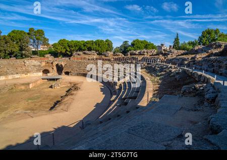 Steps and the arina of the Roman Amphitheater of Mérida illuminated by the light of dawn creating shadows from its steps in Badajoz, Extremadura, Spai Stock Photo