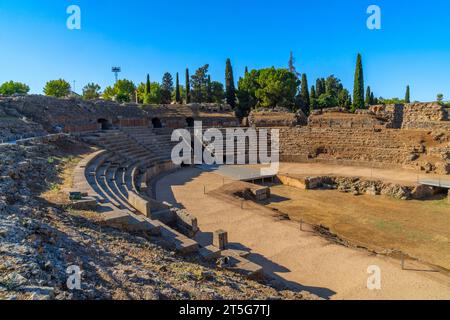 Steps and the arina of the Roman Amphitheater of Mérida illuminated by the light of dawn creating shadows from its steps in Badajoz, Extremadura, Spai Stock Photo