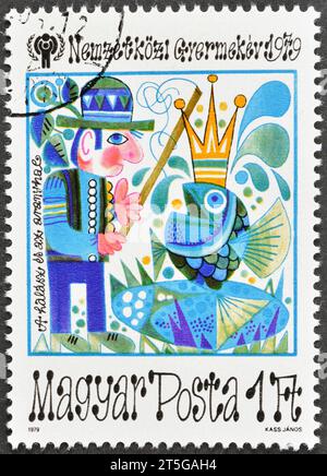 Cancelled postage stamp printed by Hungary, that shows The Fisherman and the Goldfish promoting International Year of the Child, circa 1979. Stock Photo