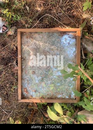 Dirty broken mirror on the ground Stock Photo