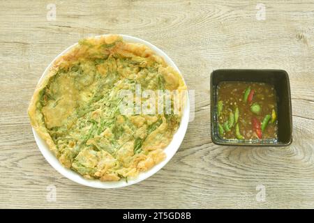 fried egg stuffed climbing wattle on plate dipping with spicy shrimp paste chili sauce Stock Photo