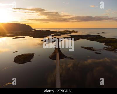 The bridges of Fredvang, Lofoten, Norway, at sunset. Clear skies, beautiful colors, reflections, aerial view from the south. Stock Photo
