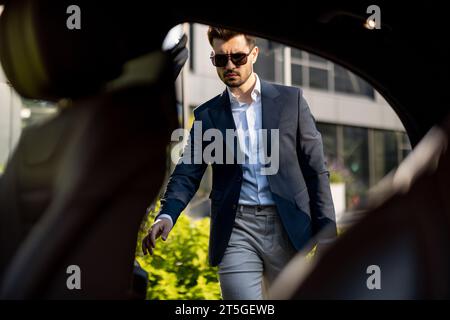 Businessman getting in the car Stock Photo