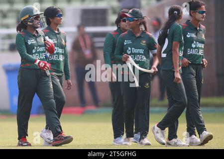 Bangladesh women cricket team Captain Nigar Sultana Joty (L) along teammates walk through as Pakistan women's cricket team competed to a five-wicket w Stock Photo