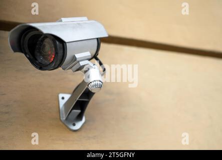Surveillance Video camera on wall controlling entrance to house or office Stock Photo