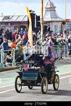 Brighton UK 5th November 2023 - Participants wave to the crowds on Brighton seafront during  this years RM Sotheby's London to Brighton Veteran Car Run commemorating the famous Emancipation Run of November 1896.  : Credit Simon Dack / Alamy Live News Stock Photo