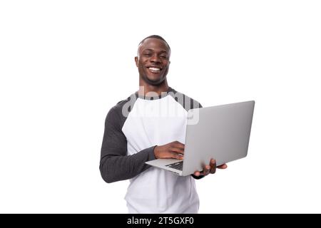 young african man working remotely in the field of IT and using a laptop Stock Photo