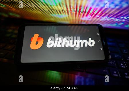 In this photo illustration, the Bithumb logo is seen displayed on a ...