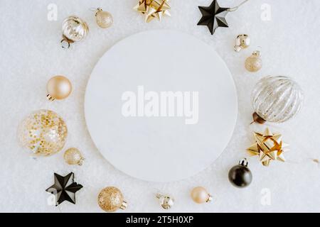White marble cosmetic podium product design and Christmas golden and black decorations. Product presentation scene for cosmetic or beauty product pres Stock Photo