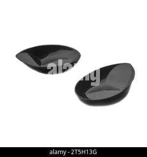 Two black plastic dessert plates isolated over white background, confectionery object photography, clipart wallpaper Stock Photo