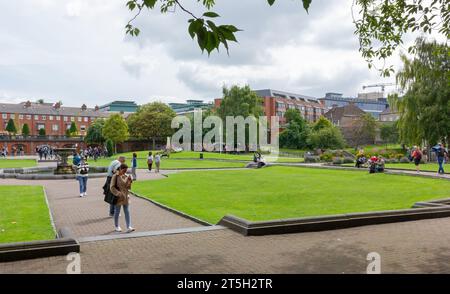 DUBLIN, Ireland - August 4, 2023: Crowded Saint Patrick's Park in a midsummer afternoon Stock Photo