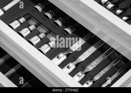 Hardware toolkit with many different garage equipment. Automobile fix background. Screwdriver metal bits set Stock Photo