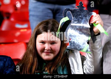 A young fan in the stands holds up a replica of the Emirates FA Cup trophy ahead of the Emirates FA Cup first round match at The Valley, London. Picture date: Sunday November 5, 2023. Stock Photo