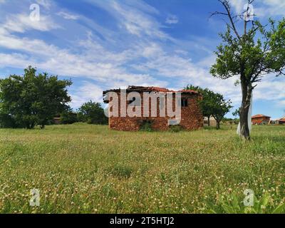 Abandon old house and View to a spring landscape in rural Macedonia, near Vinica, Macedonia Stock Photo