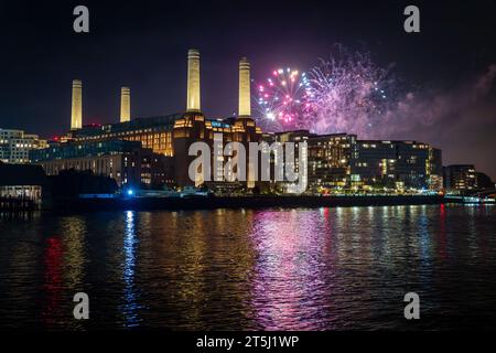 Battersea Park fireworks over Battersea Power Station, reflected int he River Thames, November 2023 Stock Photo