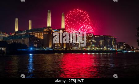 Battersea Park fireworks over Battersea Power Station, reflected int he River Thames, November 2023 Stock Photo