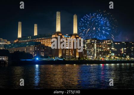 Battersea Park fireworks over Battersea Power Station, reflected int he River Thames, November 2023 Stock Photo