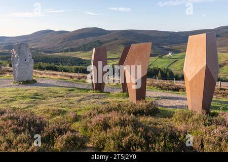 'The Watchers', an Art Installation by John Kennedy, & the Standing Stone 'A Moment in Time' by Louise Gardiner Overlooking Corgarff Castle Stock Photo