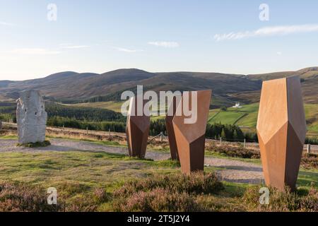 'The Watchers', an Art Installation, & the Standing Stone 'A Moment in Time' in the Cairngorms National Park Overlooking Corgarff Castle Stock Photo