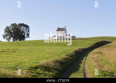 A Hillside Tracking in Strathdon Leading to Corgarff Castle, a Tourist Attraction in the Scottish Highlands in Aberdeenshire Stock Photo