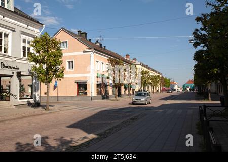 EKSJÖ, SWEDEN ON MAY 16, 2018. Exterior small-town buildings. Wooden or plaster wall. Unidentified people. Editorial use. Stock Photo