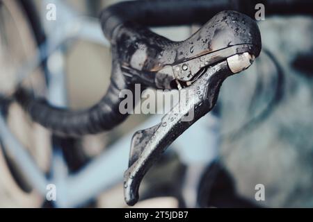 Right brake lever on a gravel bike covered with rain drops on a drop flared bar Stock Photo