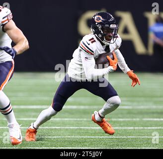 Chicago Bears wide receiver Darnell Mooney (11) is pushed by Detroit ...