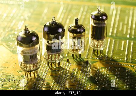 Electronic vacuum tube on yellow circuit board Stock Photo