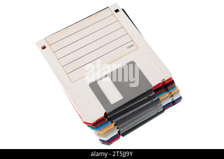 Colored old retro floppy diskettes in stack. Isolated on white background. Stock Photo