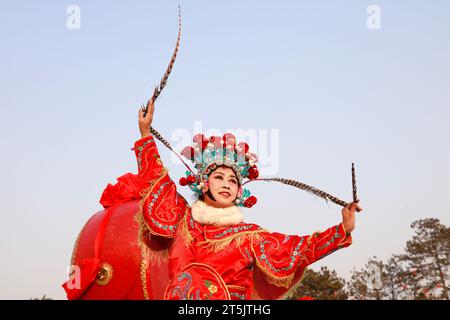 Tangshan City - February 20, 2018: Peking opera characters in the park, Tangshan City, Hebei, China Stock Photo