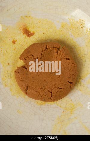 close-up of ground turmeric rhizomes or roots on a plate, curcuma longa, commonly used spice in cooking and medicine, taken straight from above Stock Photo