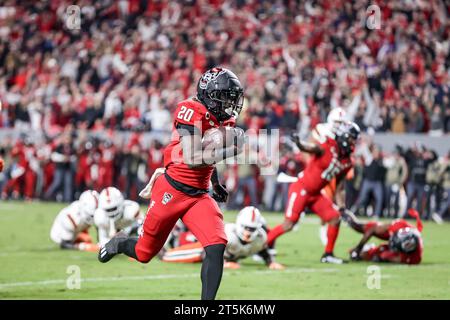 November 4, 2023: NC State freshman Kendrick Raphael (20) runs for ...