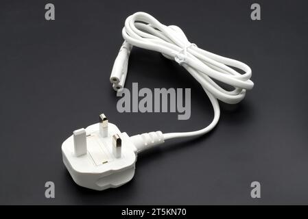 UK type power cable isolated on black background Stock Photo