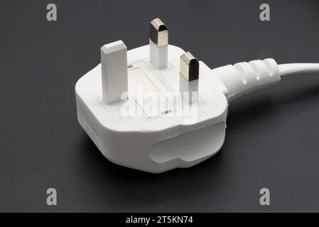 UK type power cable isolated on black background Stock Photo