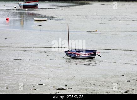 Stranded boats on the seabed during low tide in the town Cancale in northern France without people Stock Photo