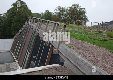 Assen, Netherlands - Oct 11 2023 The new wing of the Drents Museum in Assen was built half underground. A park has been created on the vaulted roof. Stock Photo