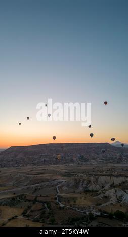 Hot air balloons. Hot air balloons flying over fairy chimneys in Cappadocia. Aerial view. Turkey tourist attractions Stock Photo