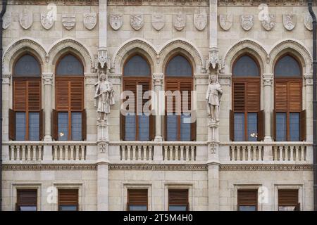 Statues and bas relief on the exterior of Hungarian Parliament Building (Hungarian: Országház). Budapest, Hungary - 7 May, 2019 Stock Photo