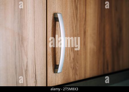 Kitchen cabinet handle, close up with selective focus Stock Photo