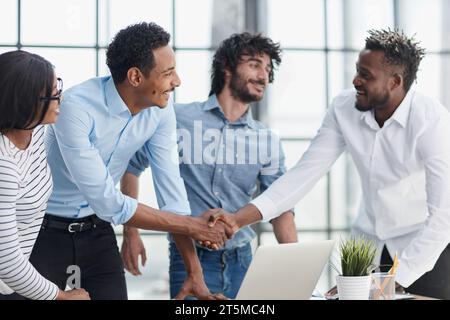 Successful Business Collaboration: Executives Greet with Handshake in Office Stock Photo
