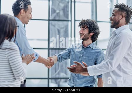 Successful Business Collaboration: Executives Greet with Handshake in Office Stock Photo