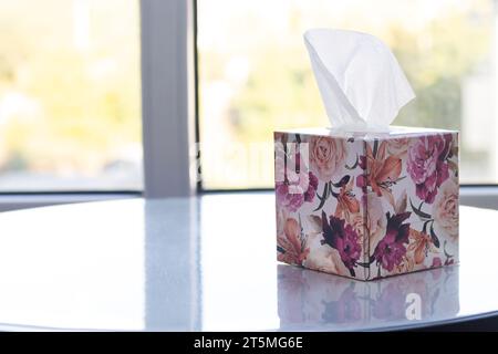 Box with paper tissues on white table Stock Photo
